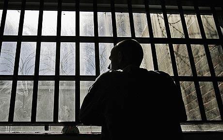 Inmate Behind His Own Bars